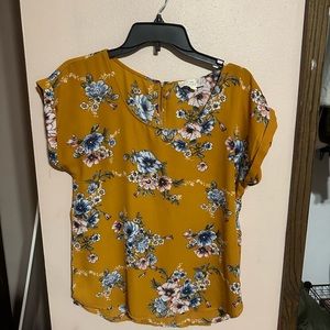 Yellow floral blouse.